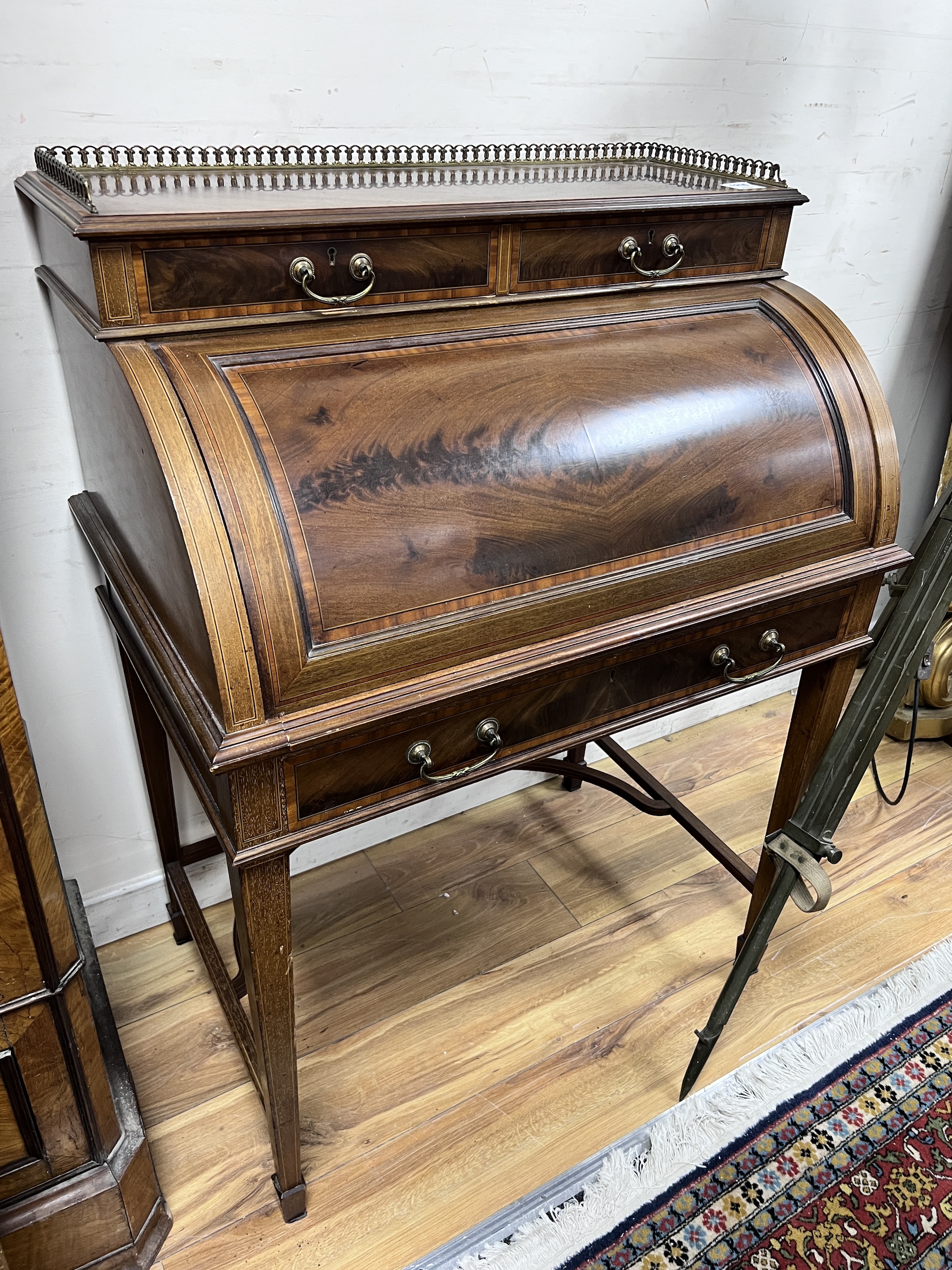 An Edwardian Maple & Co. satinwood banded cylinder bureau, width 79cm